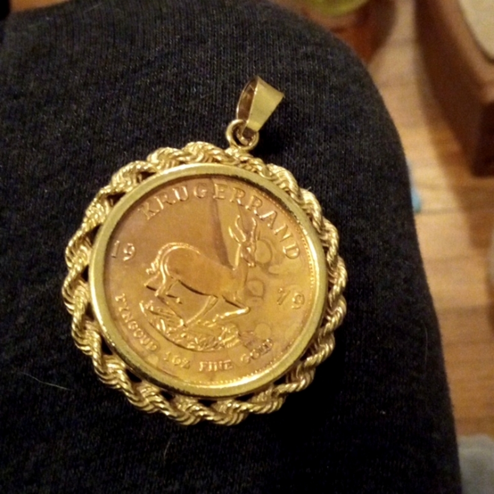 Gold colored jewelry pendant
